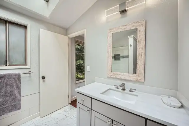 Main Bathroom has new upgrades and skylight for natural light