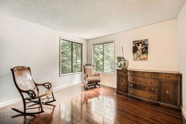 Bedroom with beautiful trees out the windows