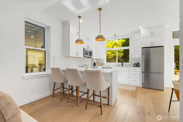 Open kitchen with seating at the bar