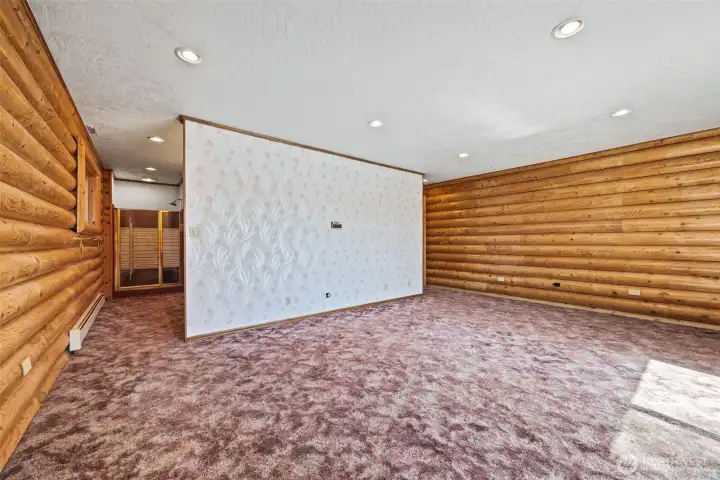 Your personal escape: large primary bedroom with direct access to the deck and endless views.