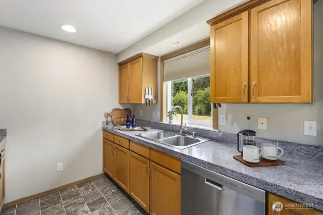 kitchen window overlooking back yard
