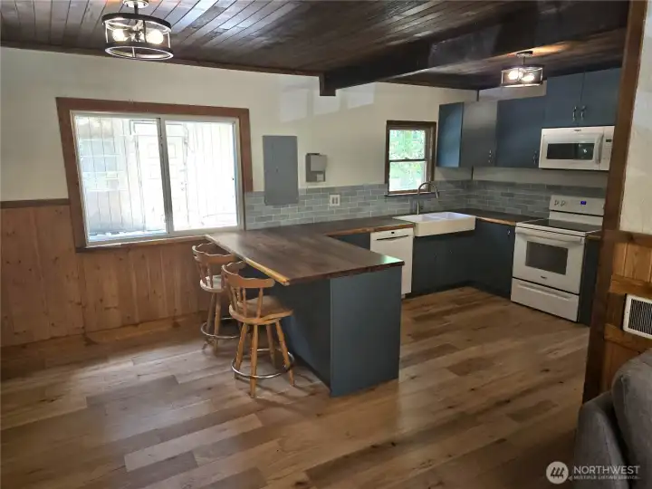 View of kitchen and dining from living room.