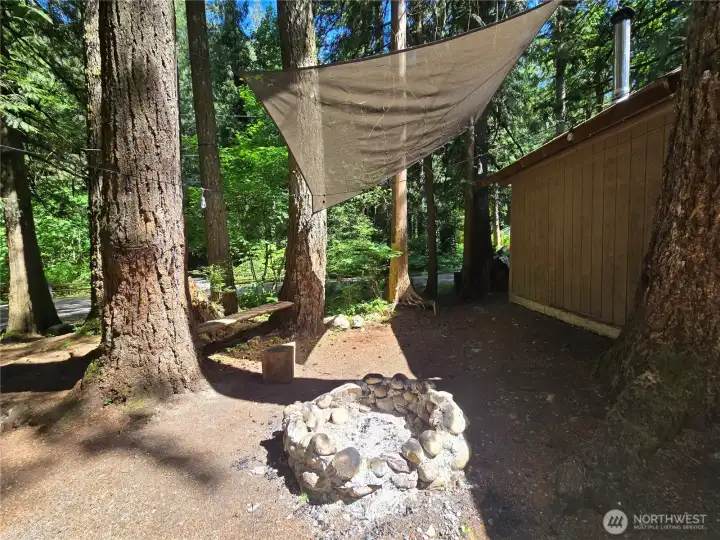 Enjoy nature around your custom river rock fire pit.