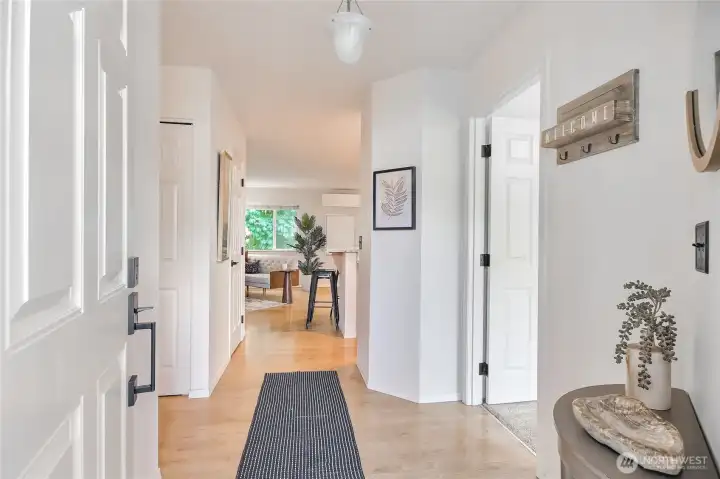 Low maintenance laminate flooring from the entry thru to the main living and kitchen area.
