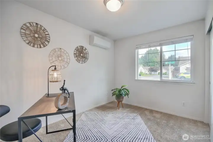 One of the three bedrooms could be used for a den or hobby room notice the mini split.