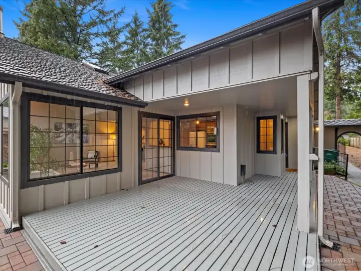 Exterior deck off entrance both covered and uncovered space to entertain or chill