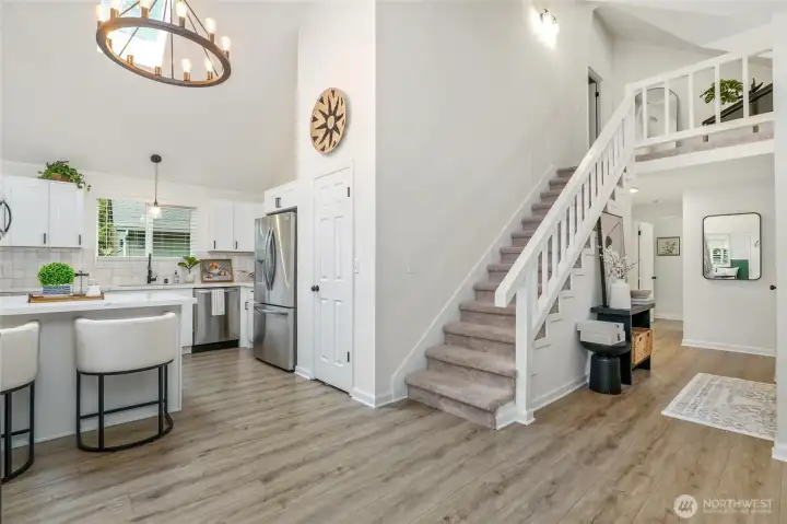 Beautiful open floor plan with high vaulted ceilings, durable vinyl plank floors.