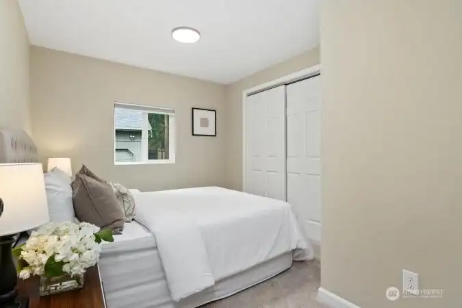 One of two bedrooms on the main floor w/wardrobe closet.