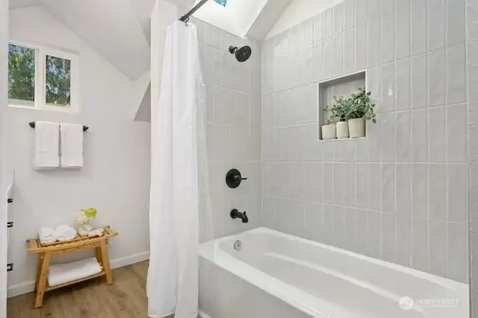 Full bathroom in primary bathroom suite