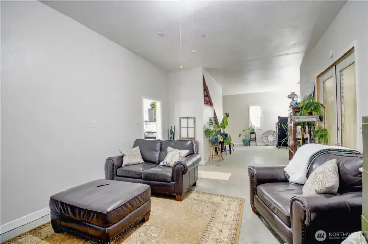 2nd bay of shop, drywall can be removed to return space back into shop space