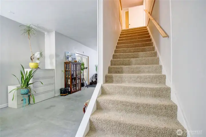 Stairs lead to storage area
