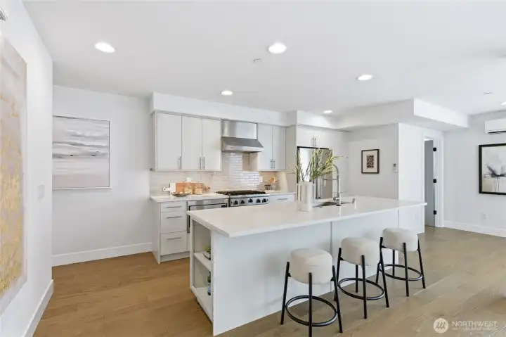 Gourmet kitchen with high end Wolf, Viking appliances, and ample storage spaces.