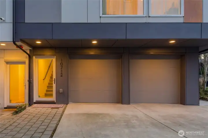 Rare side-by-side two car garage, storage room & EV car charging