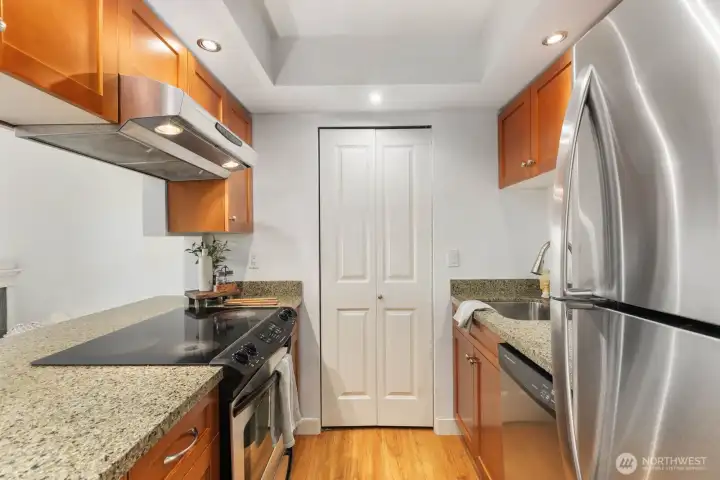 Kitchen has granite countertops and stainless steel appliances