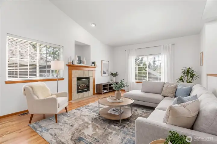 Virtually Staged - Step into the living room with vaulted ceilings, a gas fireplace and lots of natural light.