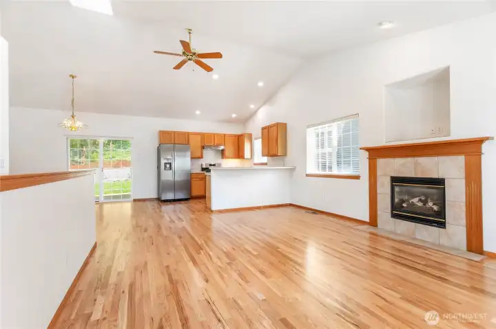 Refinished hardwood floors, new interior paint throughout, vaulted ceilings make the open space between the living, dining and kitchen areas warm and inviting