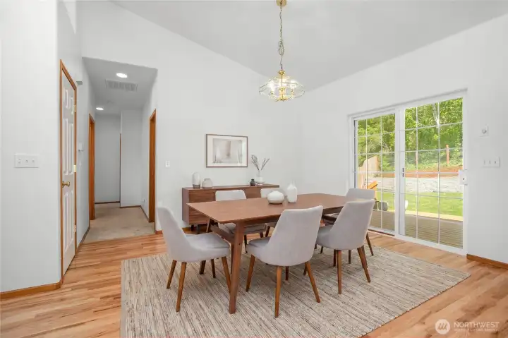 Virtually Staged - Dining Area opens up to deck and backyard