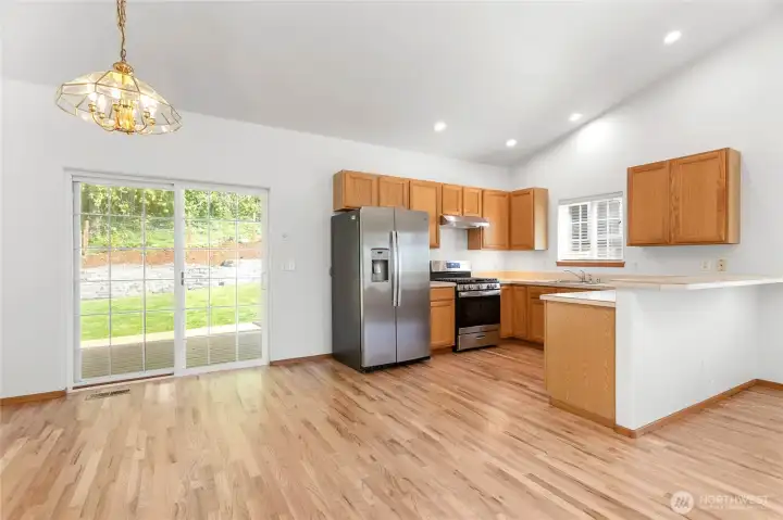 The open concept kitchen and dining areas feature lots of room for entertaining