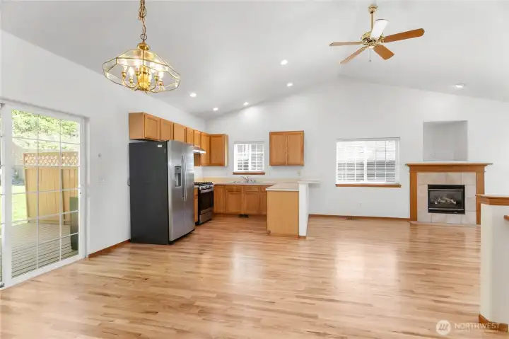 The open floorplan of the dining area, kitchen and living room provide lots of great lighting, with new paint, and beautifully refinished hardwood floors.