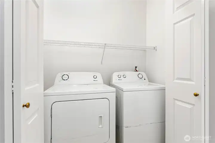 Washer/dryer in laundry closet on lower level. Washer & Dryer stay with house.