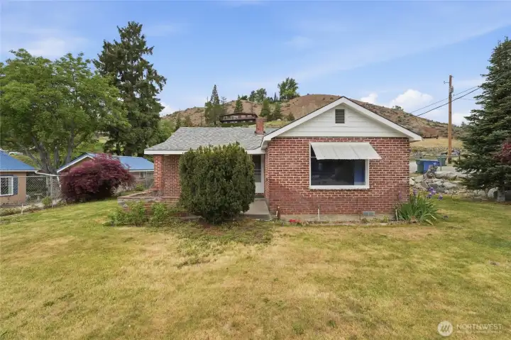 Large front yard with raspberries