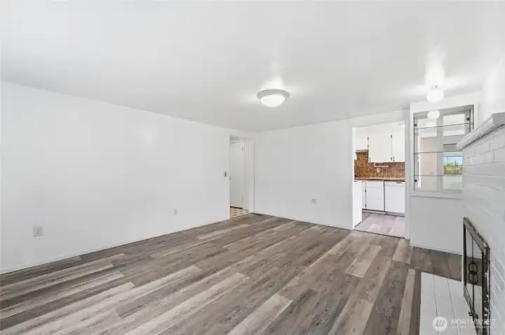 Living room with view into kitchen