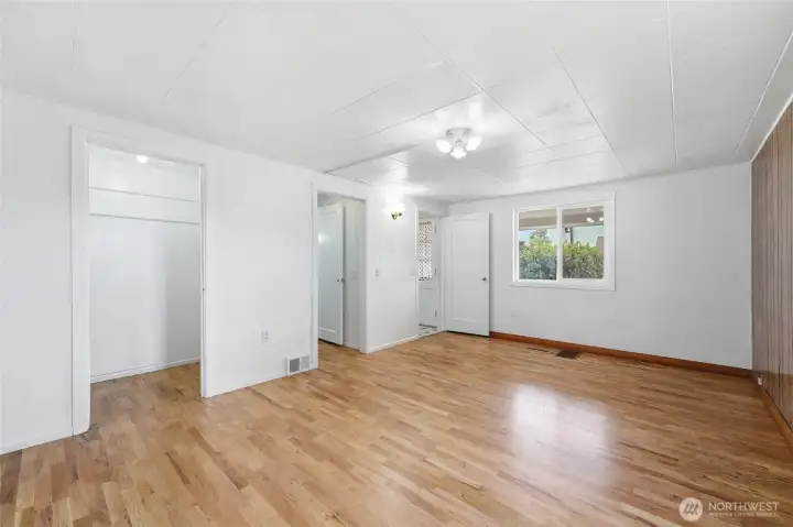 Primary bedroom with entries to 3/4 bathroom and closet