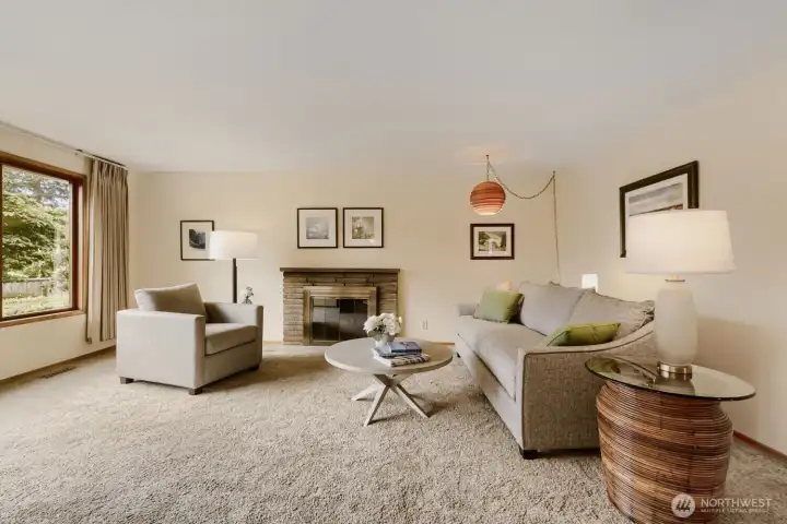 Main Floor Living Room with Wood-burning Fireplace.