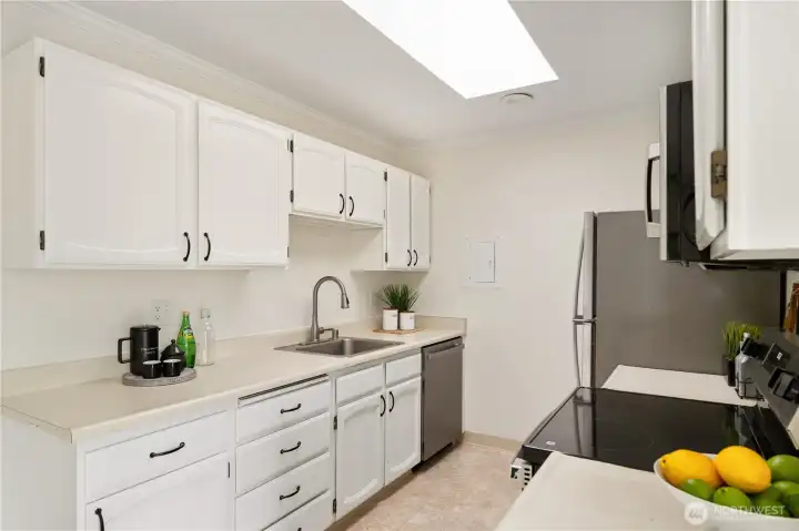 Generously sized galley kitchen with new stainless steel appliance package. Generously sized galley kitchen with new stainless steel appliance package.