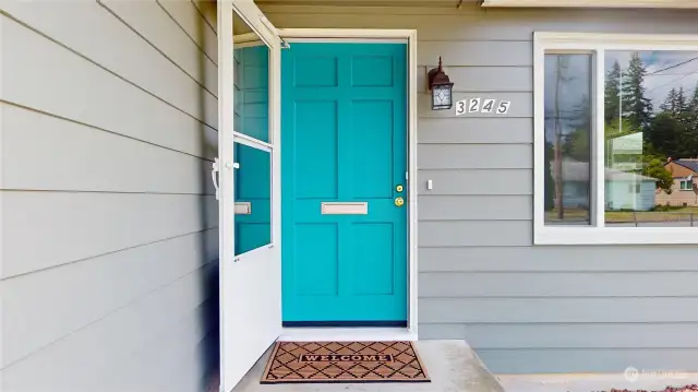 This bright and vibrant front door greets you