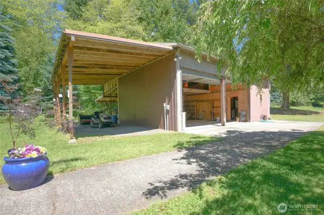 Detached 2 car garage with covered area for RV.