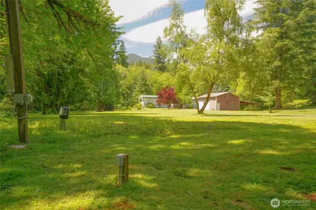 Old homesite with water and power. Could new the location of your new home or RV parking for guest.