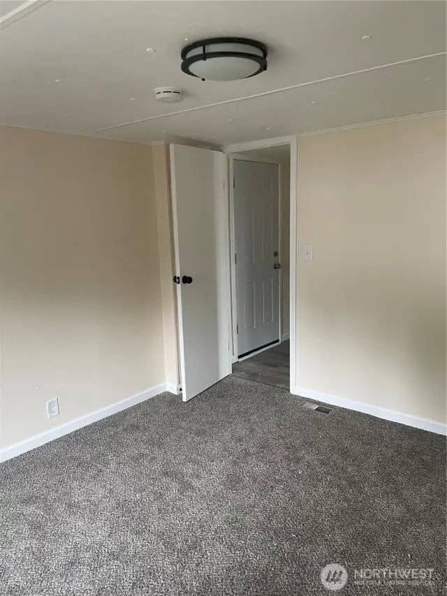 Another view of primary bedroom.
