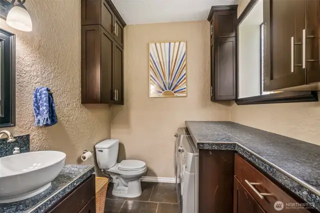 Laundry room w/ 1/2 bath, lower level off of Family room.