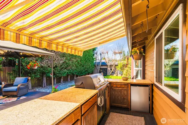 View of custom out door kitchen w/ awning