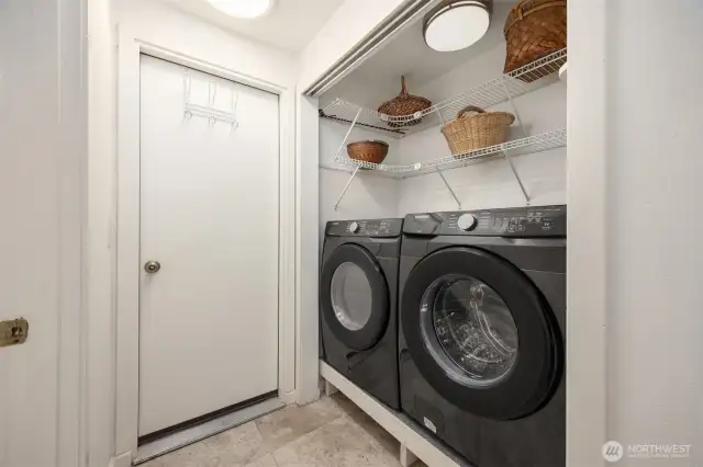 Laundry area is just off of the kitchen and near the door to the garage.