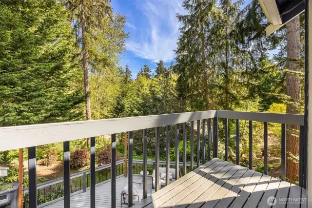 Step out onto the private balcony from the primary bedroom.