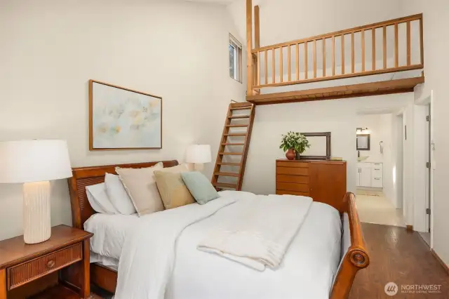 Step into the primary bedroom, where a beautiful loft adds architectural interest and extra living space.