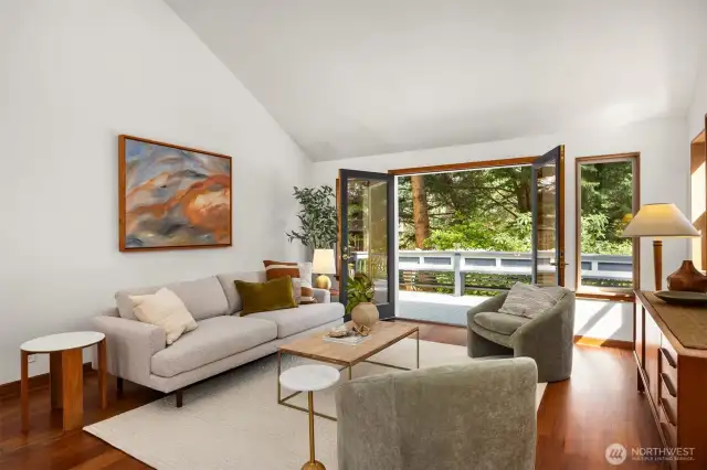 The living room is framed by vaulted ceilings, creating an open, airy atmosphere.