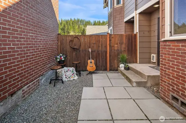 Wonderful back court yard, you could plant some grass, nice high, private fencing on both sides. Great spot to kick back and relax after a long day.