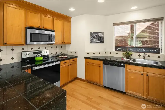 Lovely kitchen area with stainless appliances. All appliances stay!