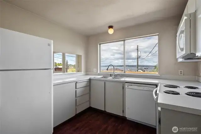 Kitchen appliances include dishwasher and microwave