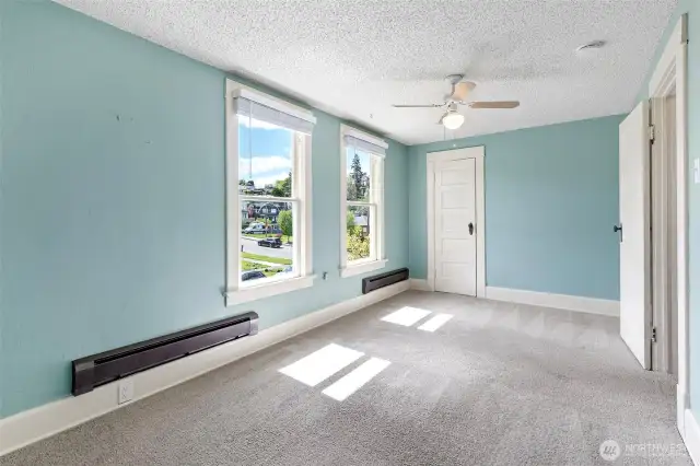 Upper unit living room with closet