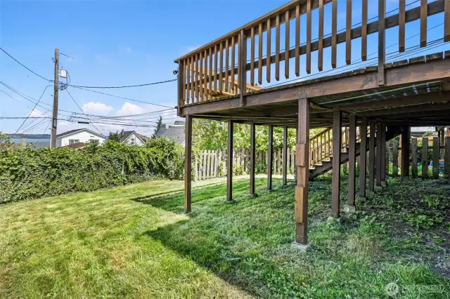 Deck off ground floor unit features stairs to back yard