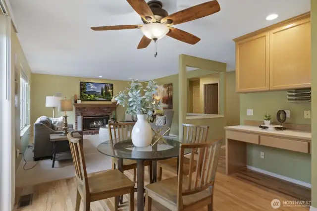 Informal eating space between the kitchen and family room with sliders to the backyard.
