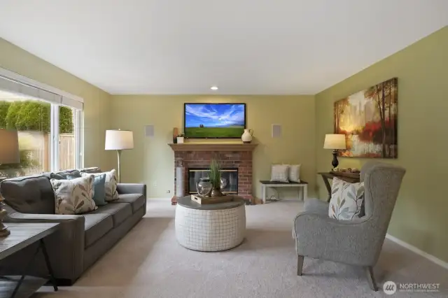 Gas fireplace with brick surround and custom hearth.