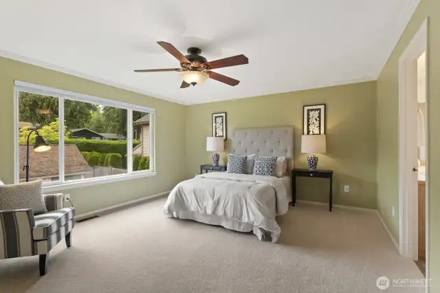 Upstairs primary suite with private bath, walk-in closest, and lovely views.