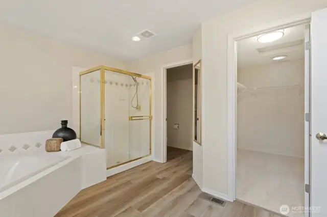 Generous sized primary suite walk-in closet.