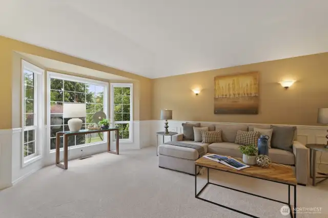 Light bright living spaces including the formal living room with vaulted ceilings and picturesque bay window.