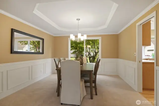 Formal dining room easily accommodates dinner parties. Don't miss the tranquil vies into the backyard.
